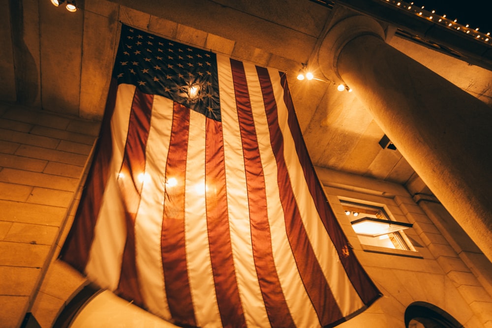 us a flag on brown wooden ceiling