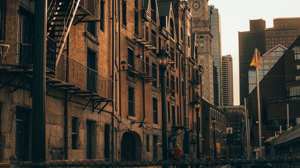 people walking on street near brown concrete building during daytime