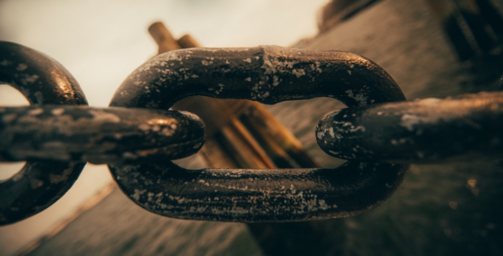 black metal chain in close up photography