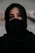 woman in black hijab taking selfie