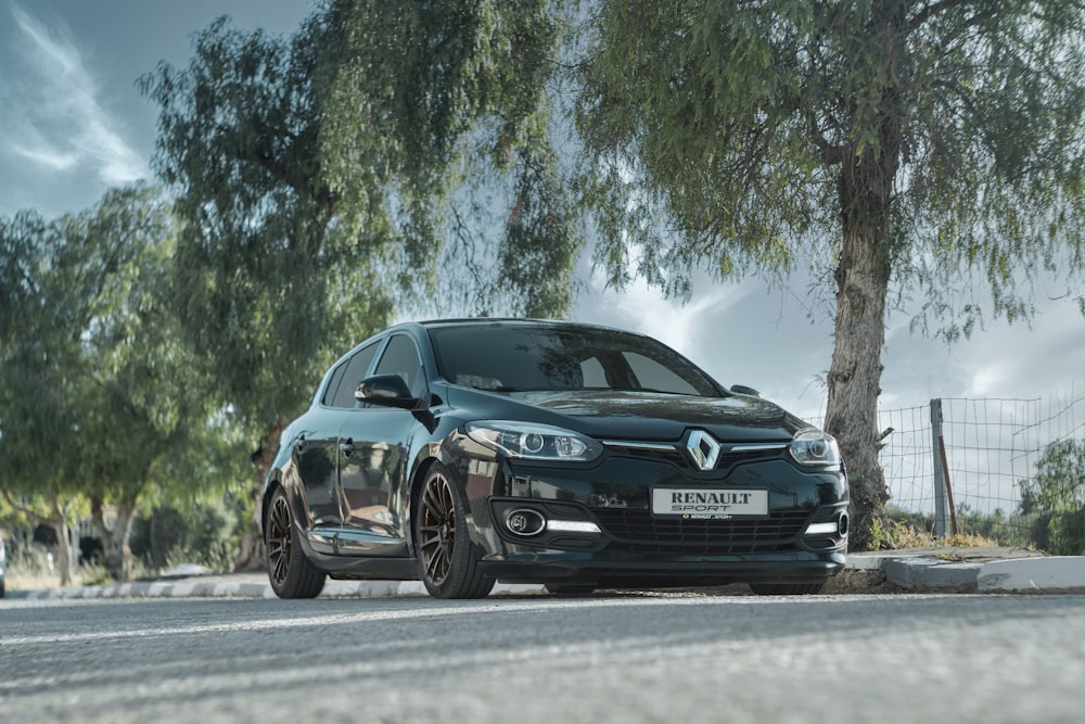 black mercedes benz coupe on road during daytime