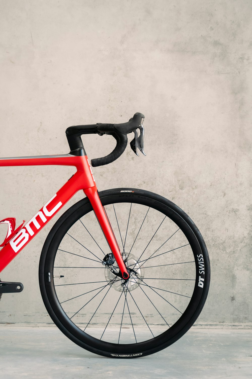 red and black bicycle on white floor