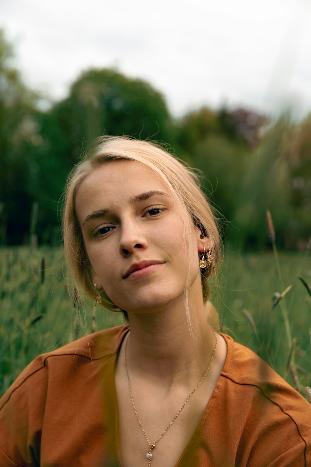 girl in orange shirt smiling