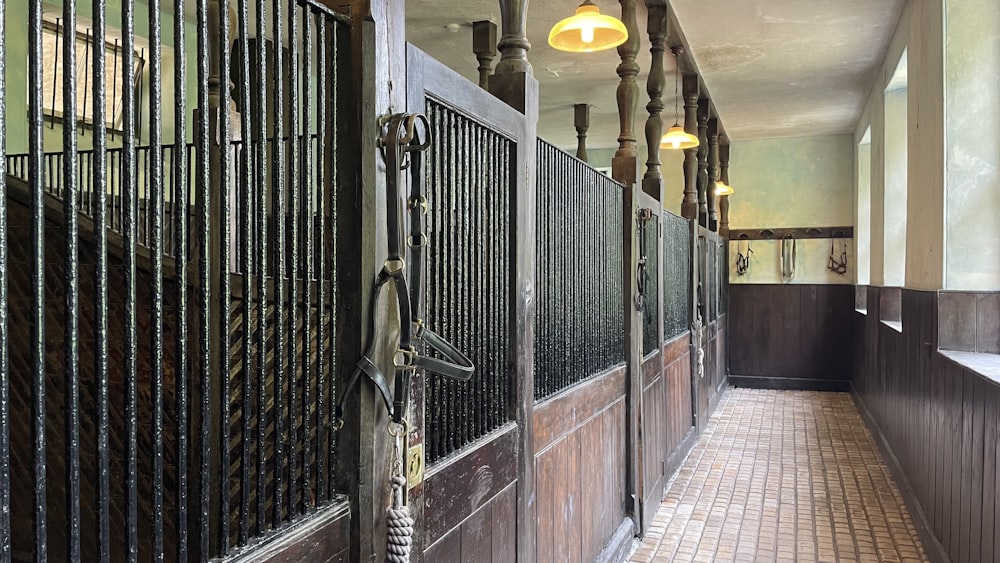 black metal gate on brown brick wall