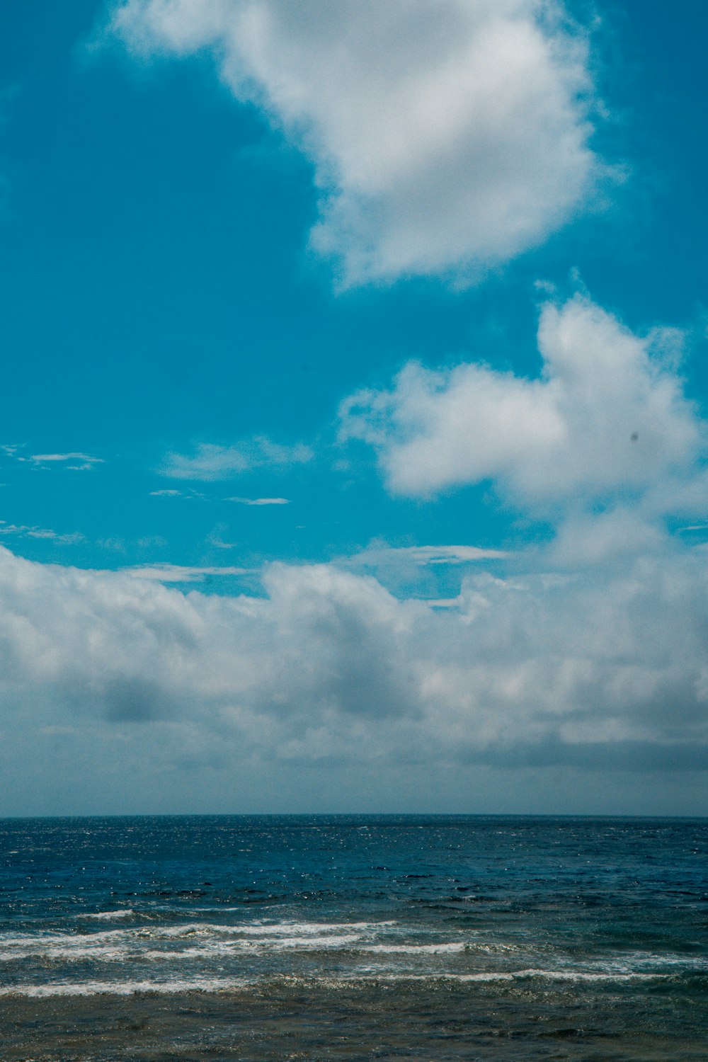 white clouds over the sea