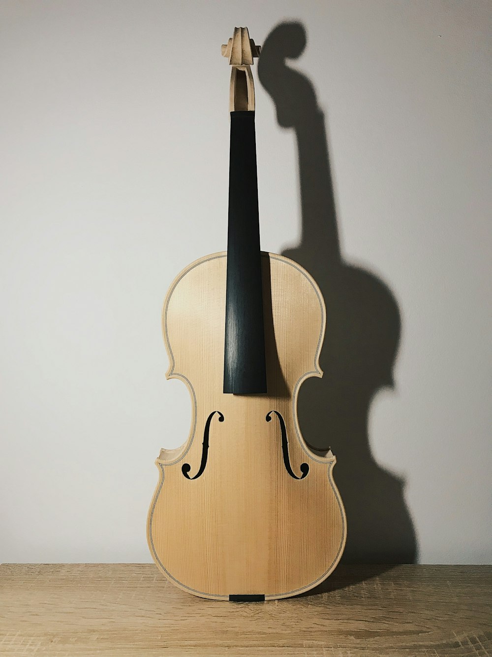brown violin with black bow