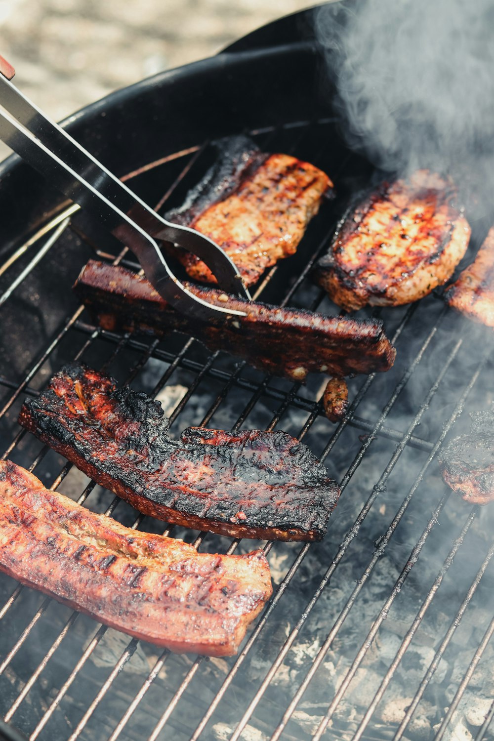 grilled meat on black charcoal grill