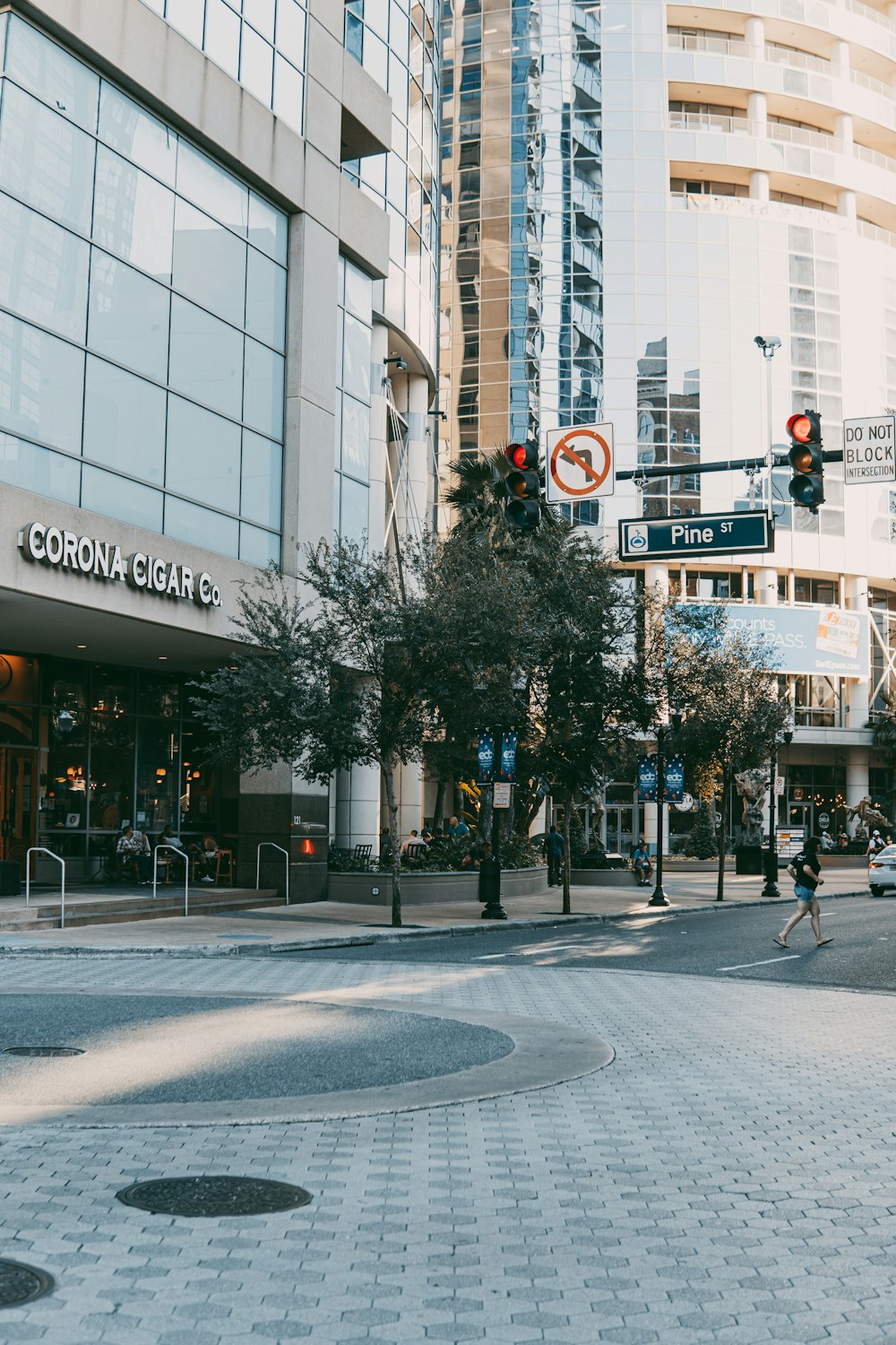 people walking on pedestrian lane near white concrete building during daytime