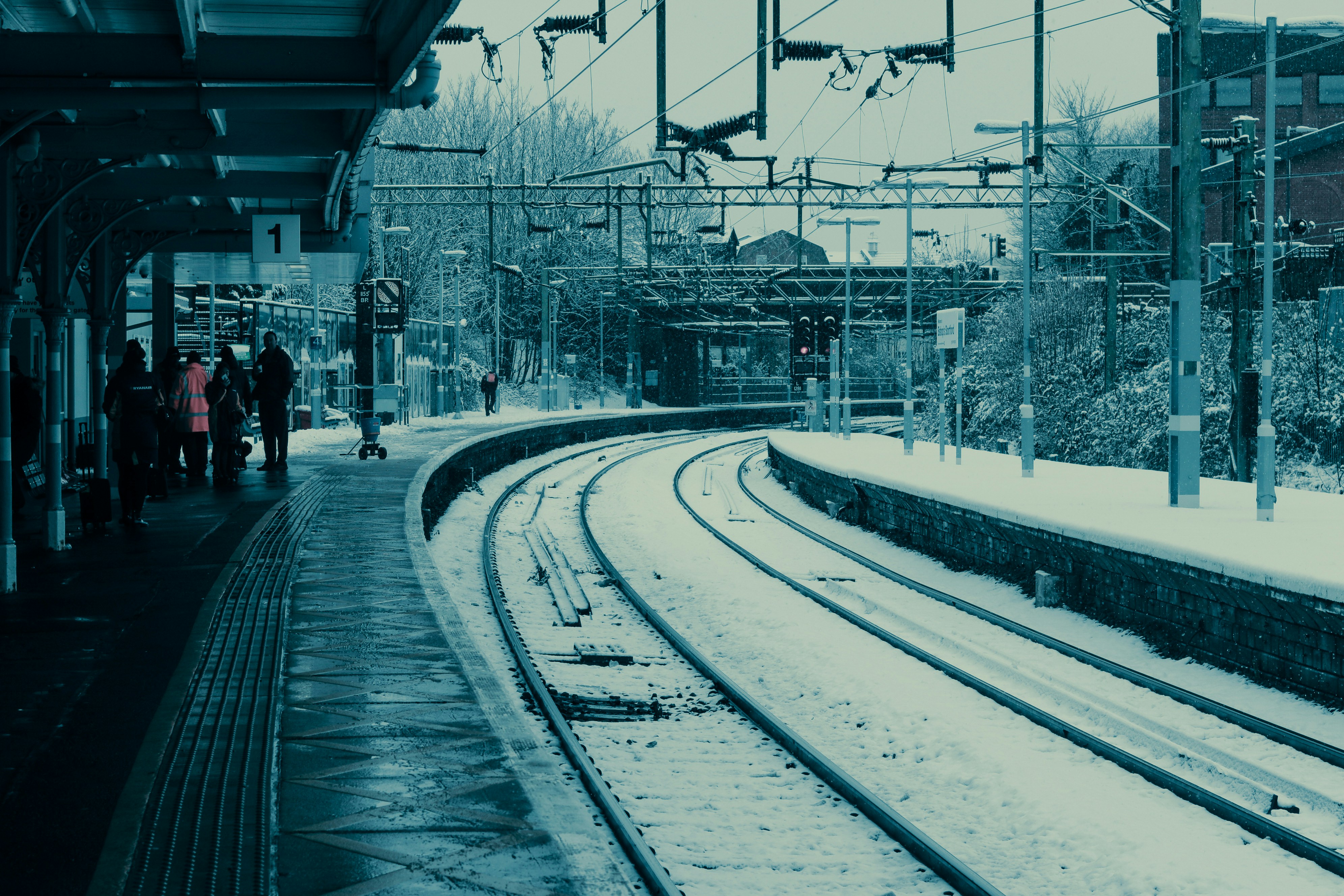 people walking on train station during daytime