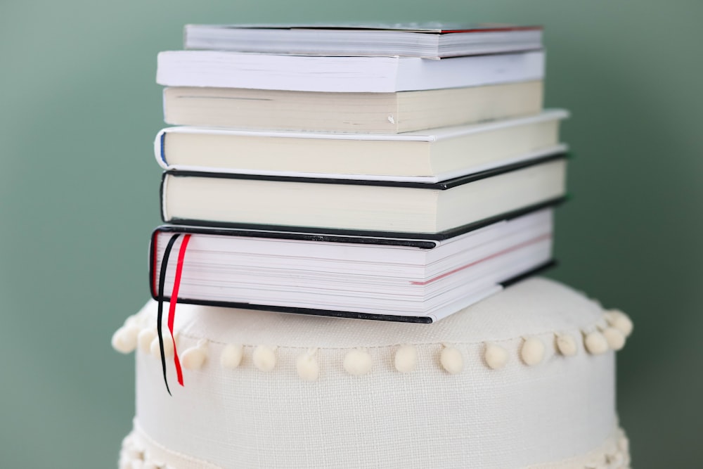 stack of books on white round table