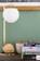 white round lamp near brown wicker basket