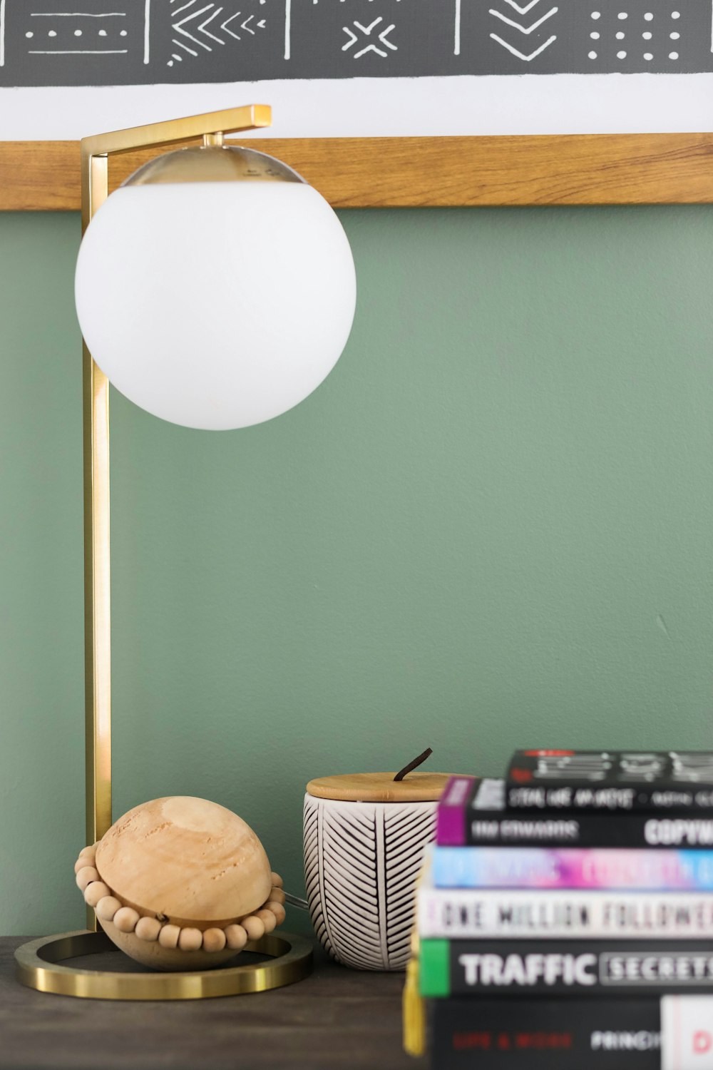 white pendant lamp near brown wooden shelf