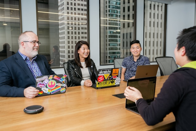 people in a design meeting in an office boardroom 