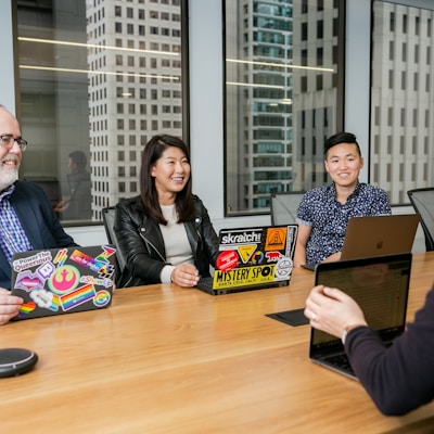 people in a design meeting in an office boardroom 