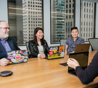 people in a design meeting in an office boardroom 