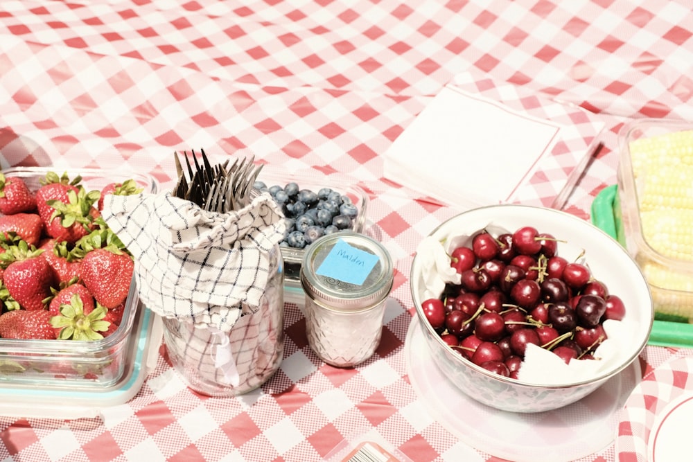 red round fruits on clear glass bowl