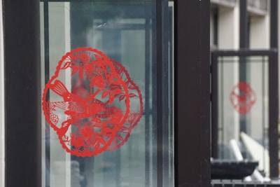 Custom vinyl decal applied smoothly on a glass window, showcasing intricate design.