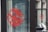 Elegant window art featuring delicate floral designs on a small business storefront.