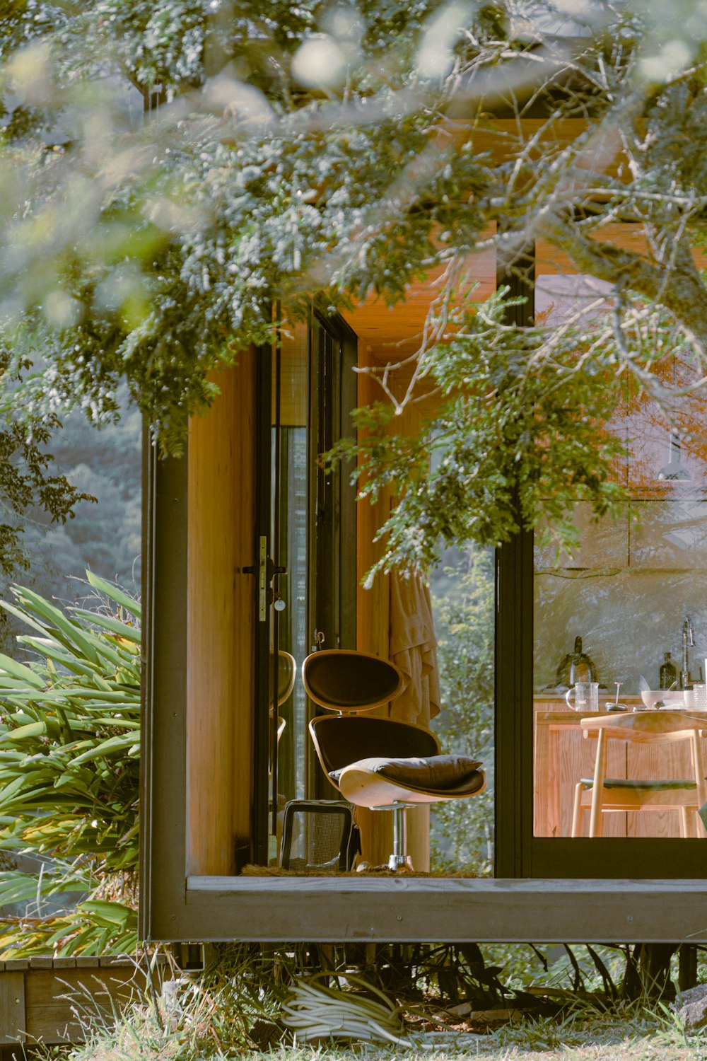 brown wooden table and chairs near brown wooden door