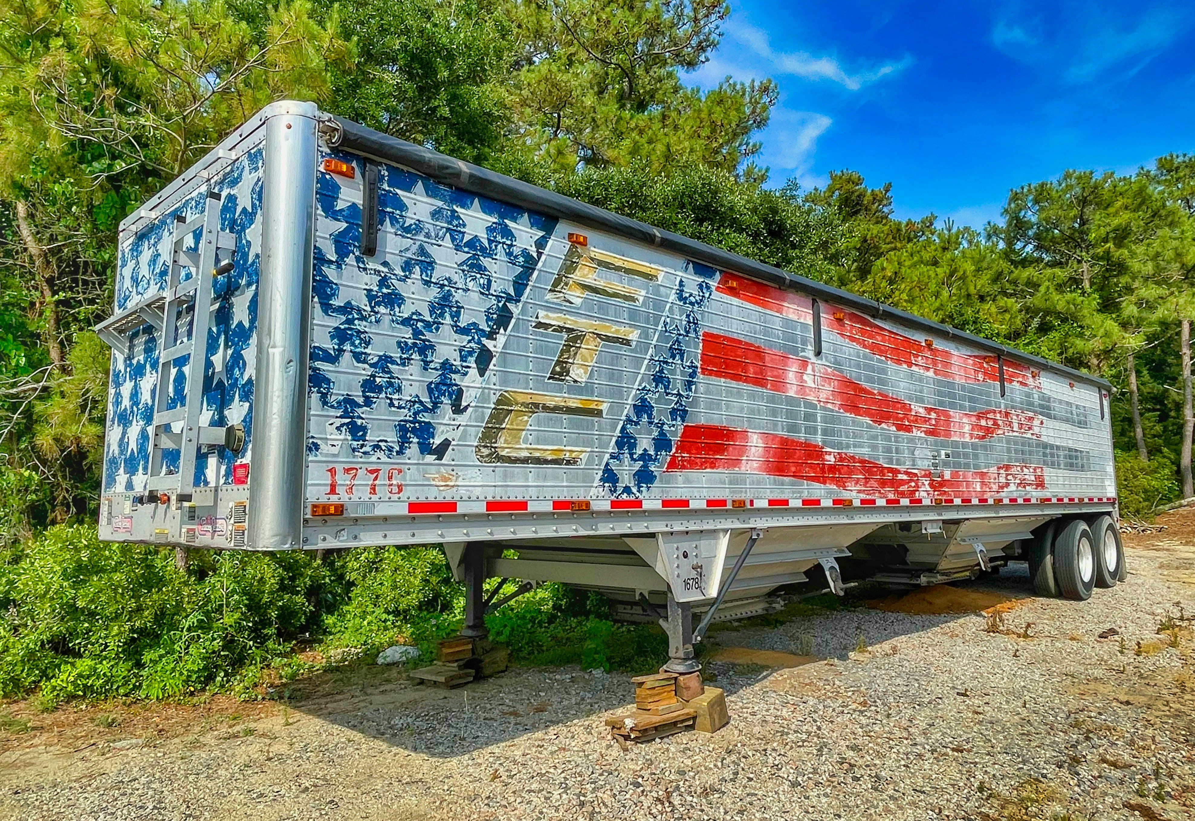 red and white trailer truck
