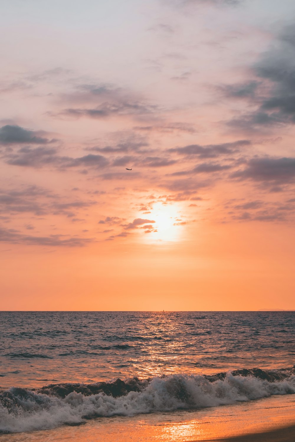 body of water during sunset