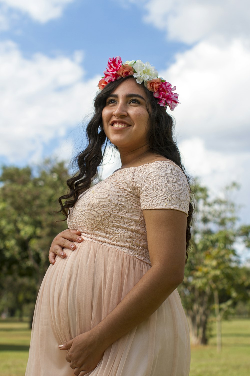 woman in white lace dress with flower crown