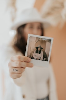 Close-up of hands holding a beautifully printed photo from the gallery order.