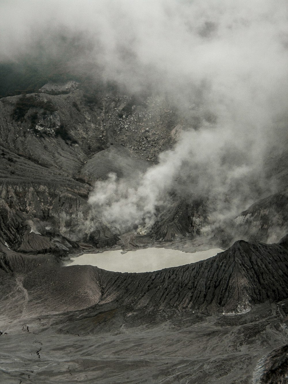 brown mountain with white clouds