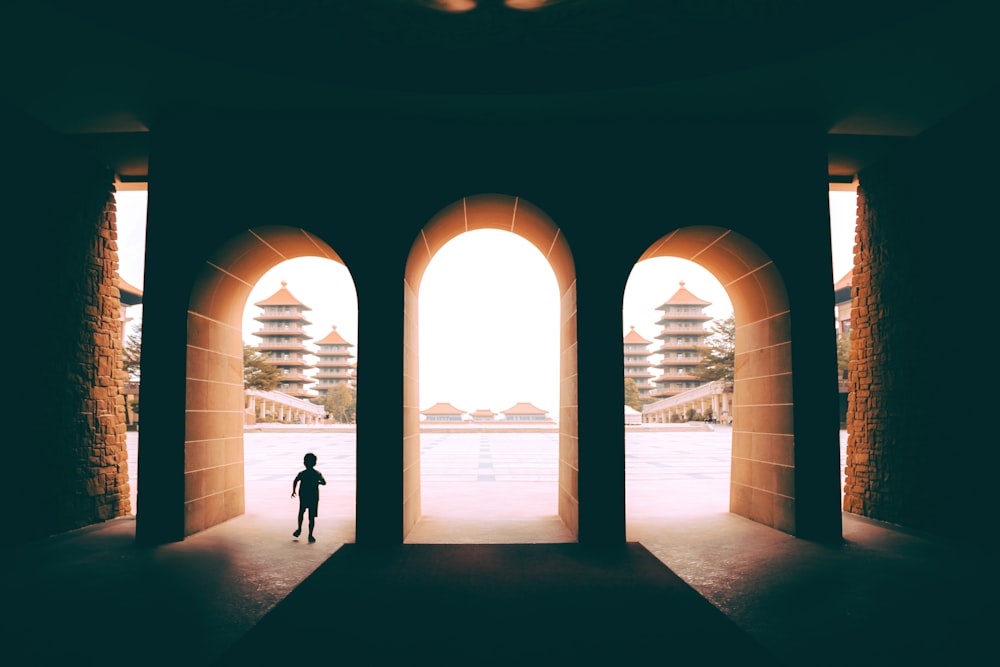 person walking on hallway during daytime