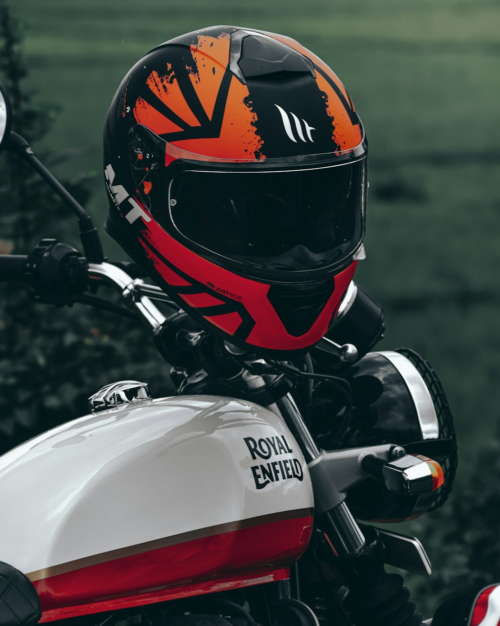 red and white motorcycle helmet