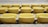 Rows of empty yellow stadium seats are arranged in a pattern. Each seat is labeled with a specific number. The seating is indoors, likely part of an arena or auditorium.