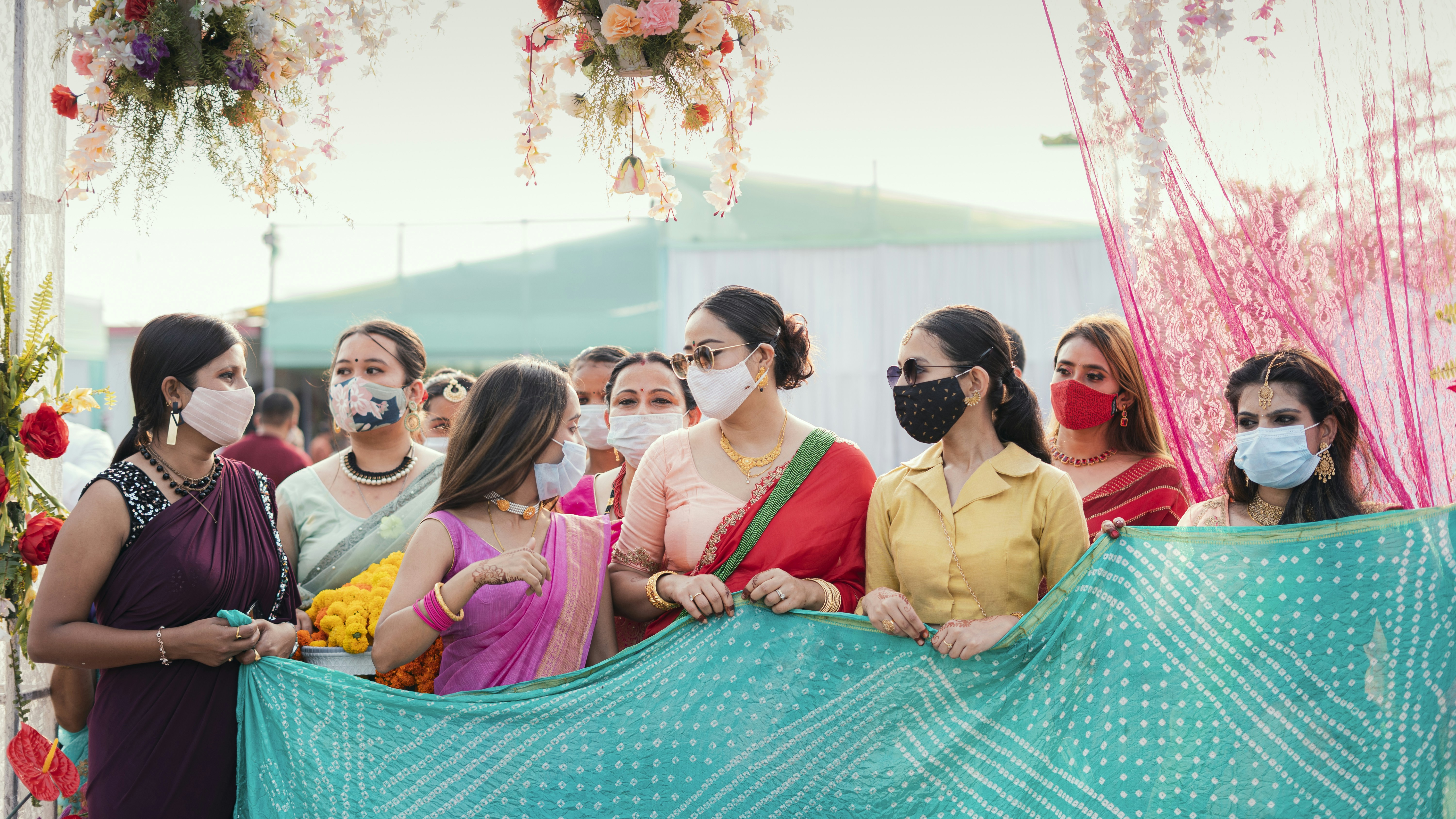 group of people sitting on blue hammock
