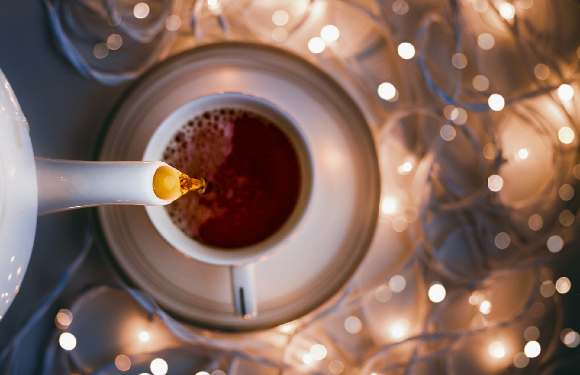 white ceramic mug on clear glass table