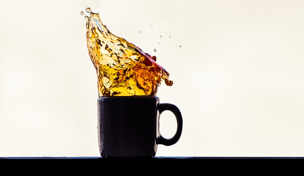 brown ceramic mug with water