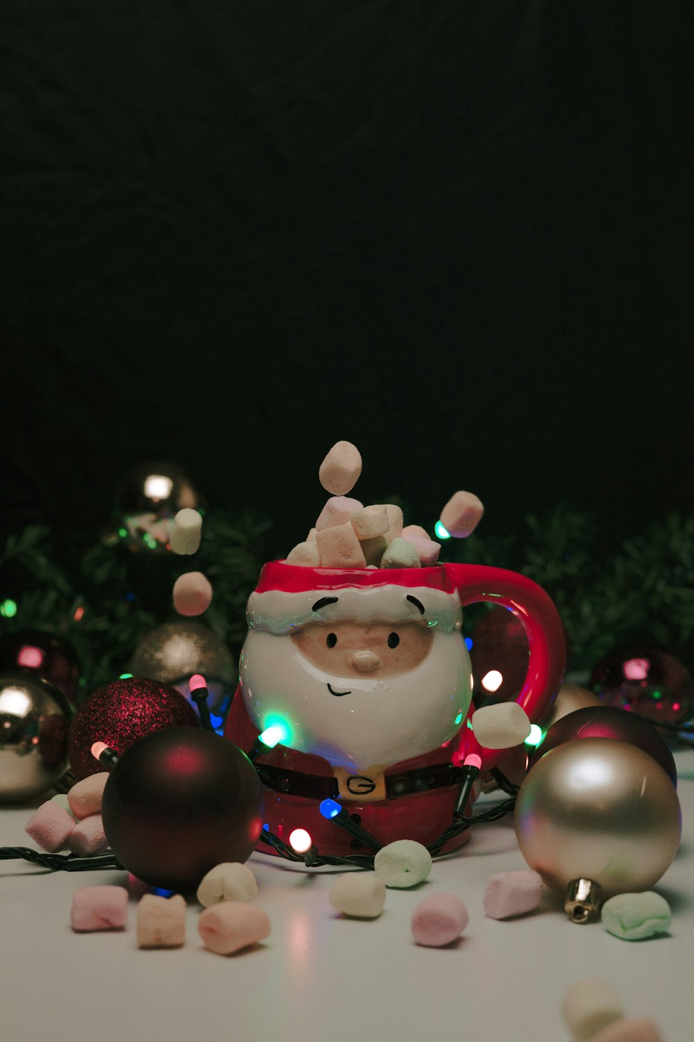 santa claus figurine with red baubles
