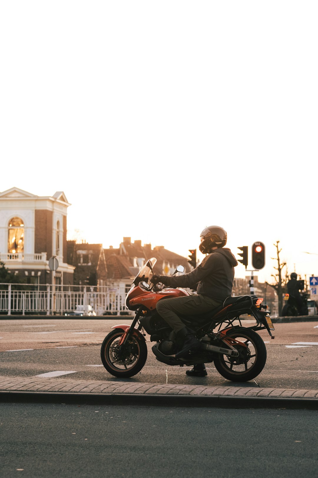 man in brown jacket riding motorcycle during daytime