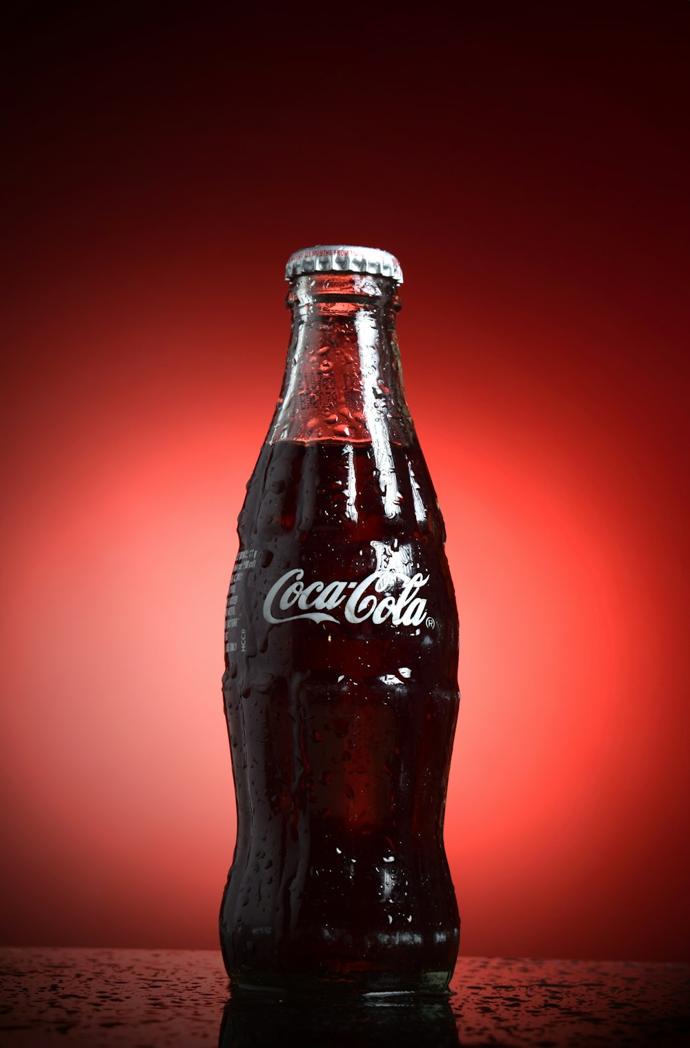 coca cola bottle with red background