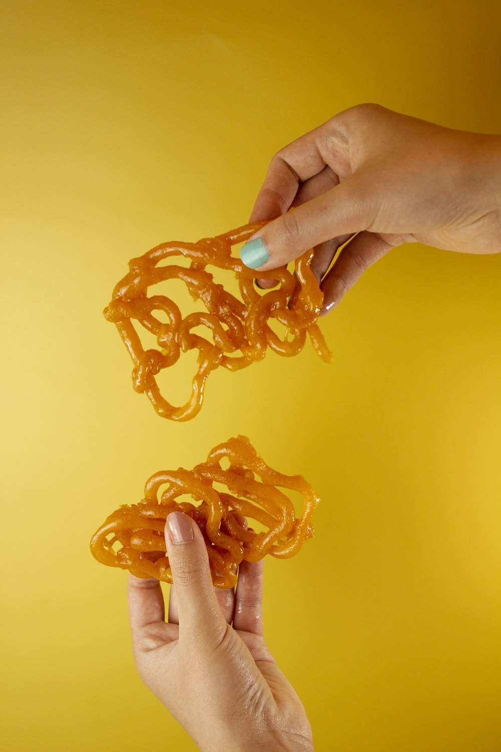 person holding orange plastic toy