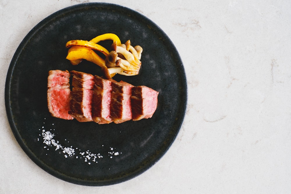 grilled meat on black plate