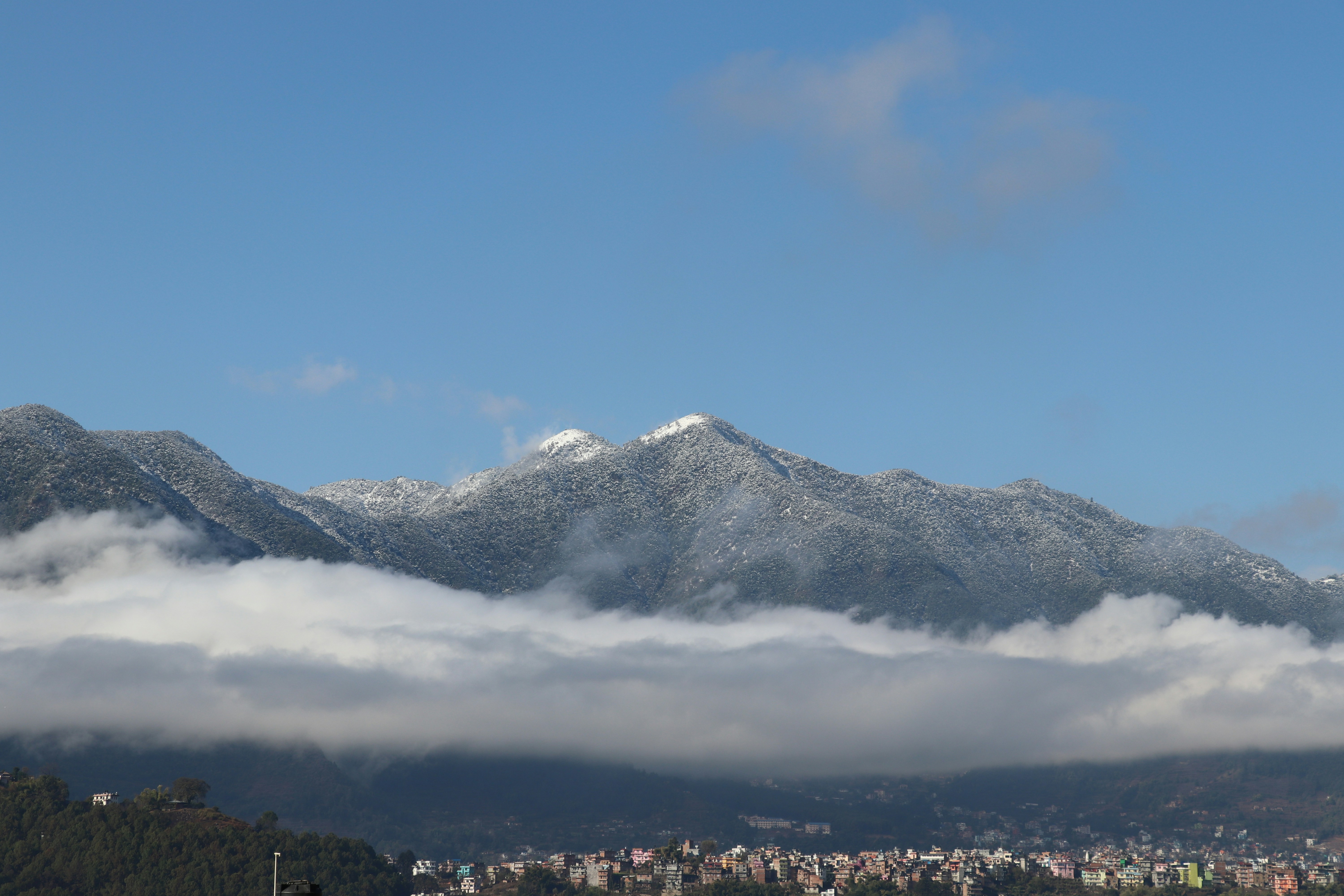 snow covered mountain under blue sky during daytime