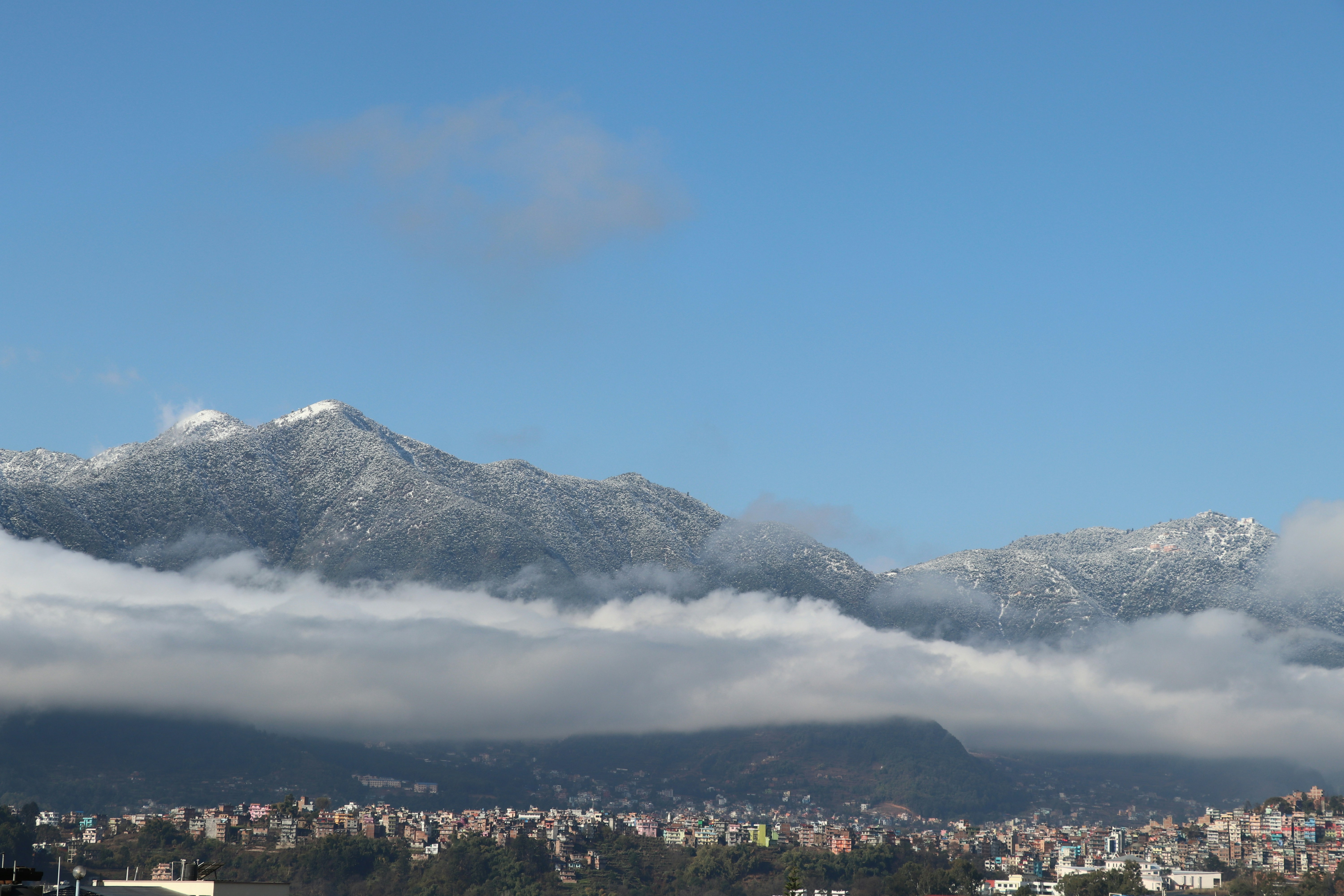 white and black mountain under blue sky during daytime