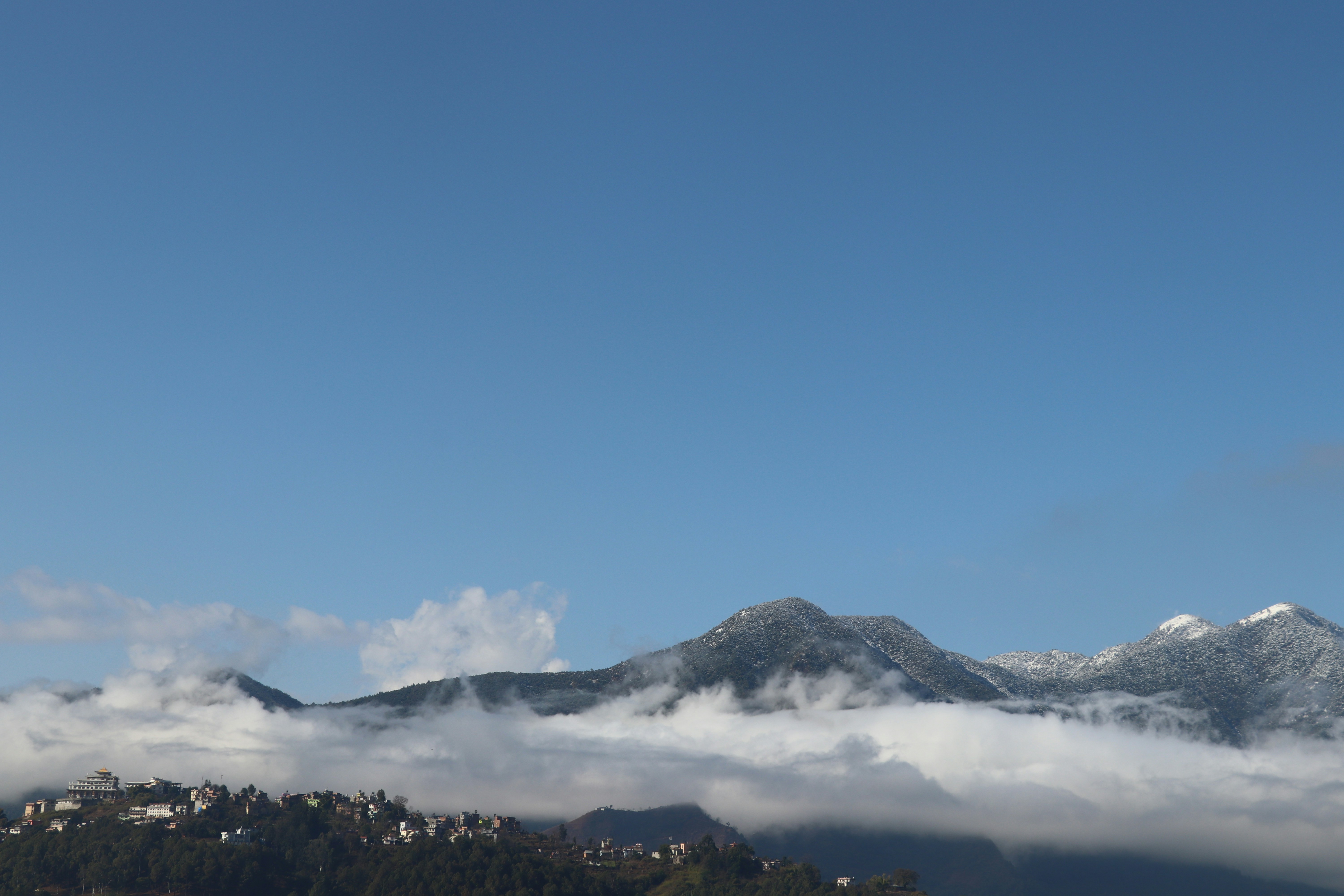 snow covered mountain under blue sky during daytime