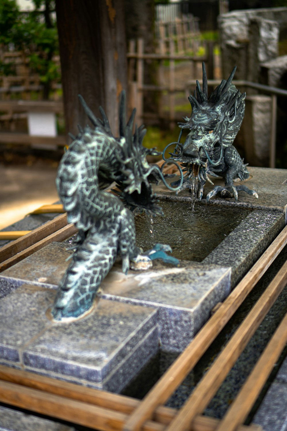 black dragon figurine on brown wooden table