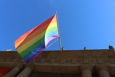 yellow red and blue flag on pole