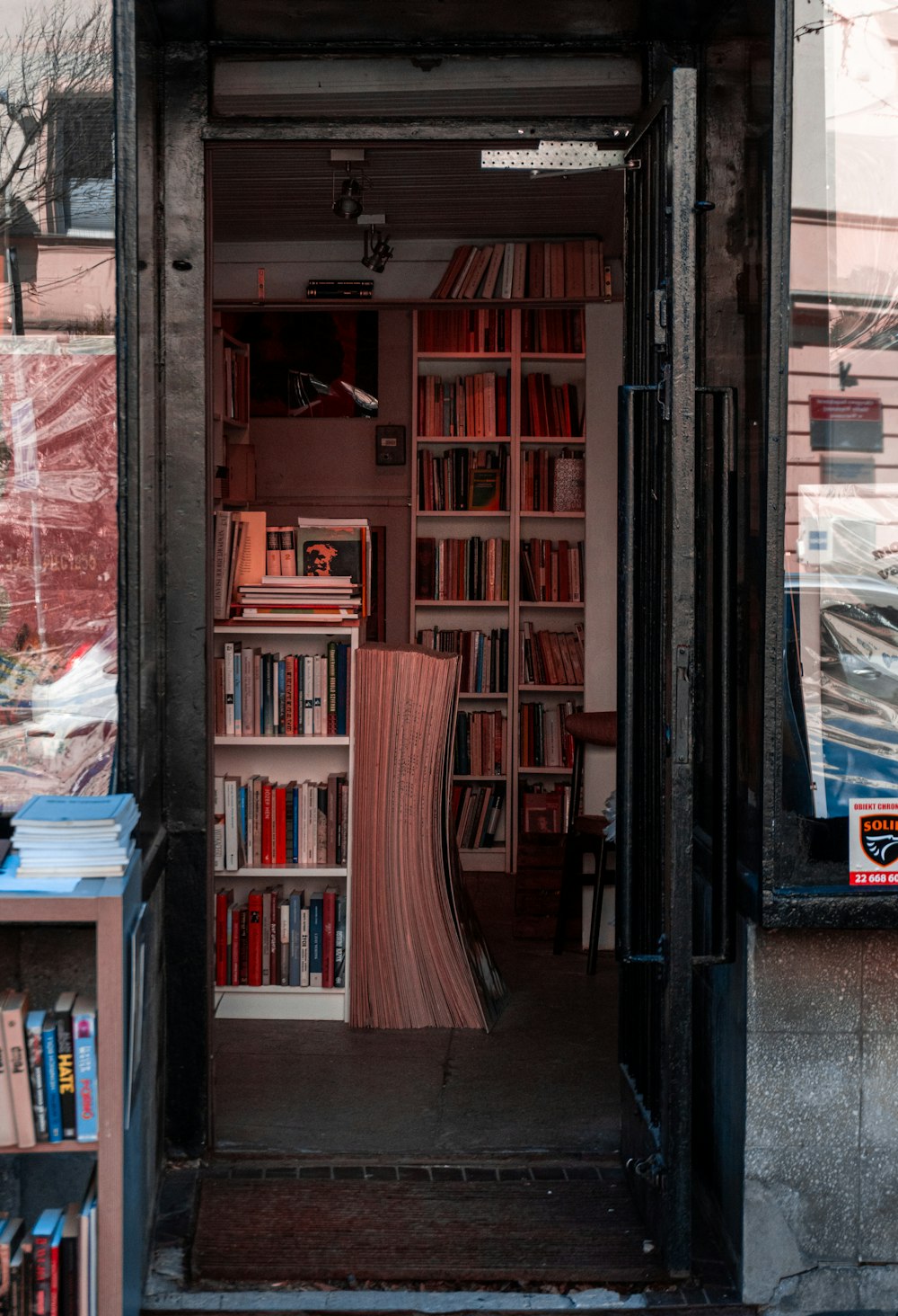 books on brown wooden shelf