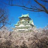 white and green temple under blue sky during daytime