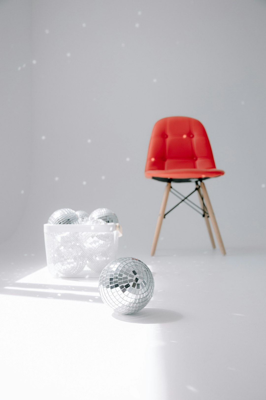 red chair with white golf ball on top