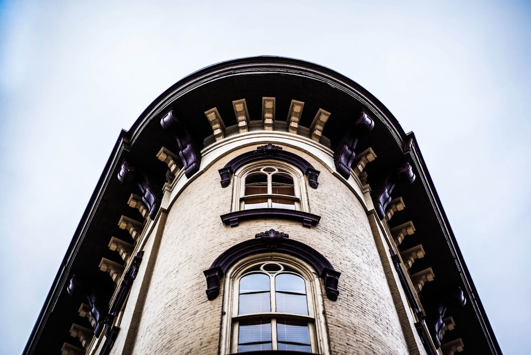 low angle photography of gray concrete building