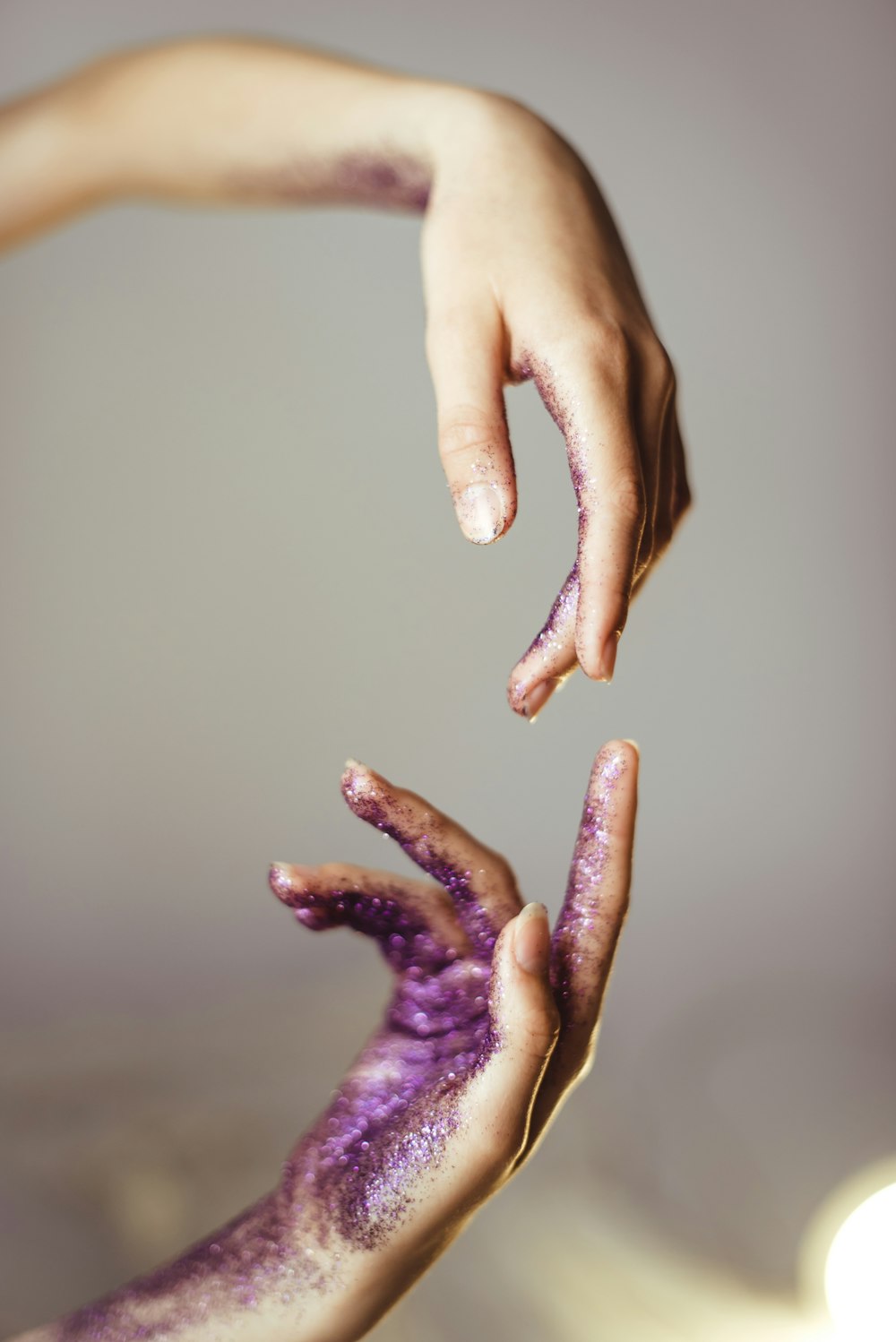 person with purple paint on hand