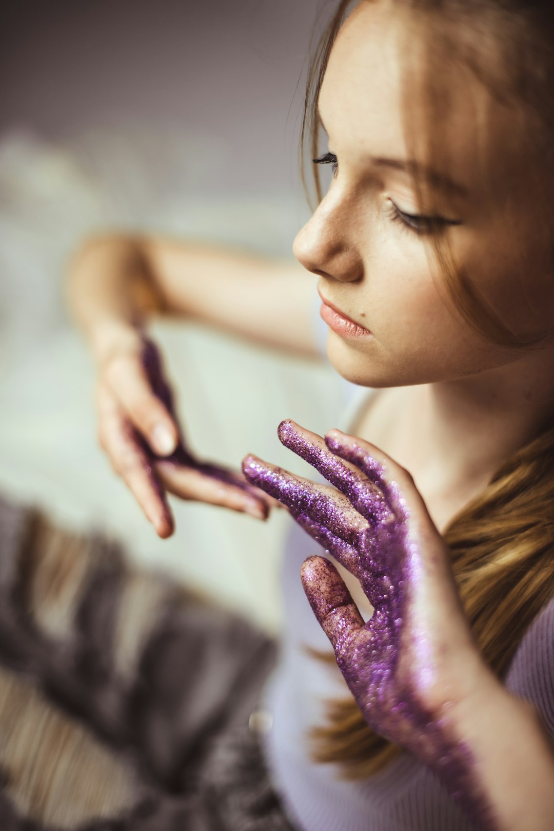 woman with purple powder on her hand